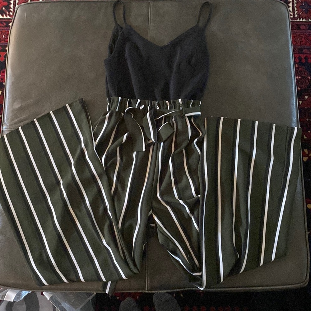 Green and white striped jumpsuit with black top. Waist band is stretchy elastic.